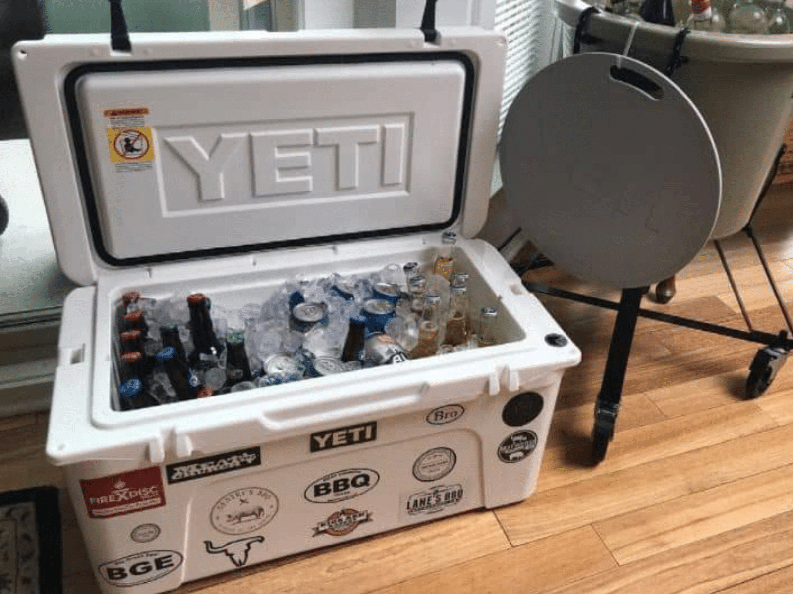 Yeti Tundra 65 hard-sided cooler full of ice and beer
