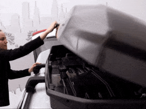 Thule SlideLock on the Motion 3 rooftop cargo box makes for easy one-handed opening, closing and securely locking.