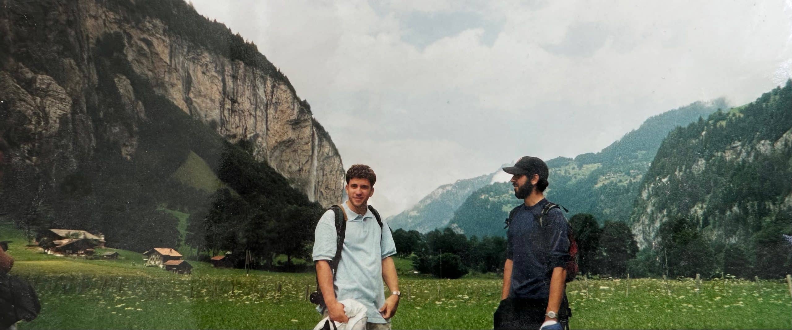Two guys standing in a field in Switzerland.