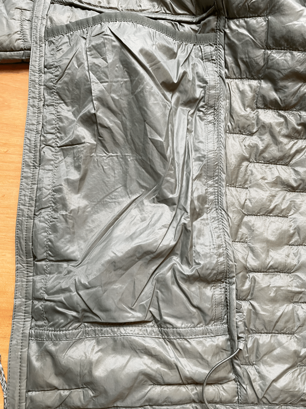 Image of the internal dump pocket on a Patagonia Micro Puff