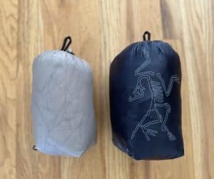 Size comparison of Cerium Hoody and Cerium SV Hoody in their stuff sacks