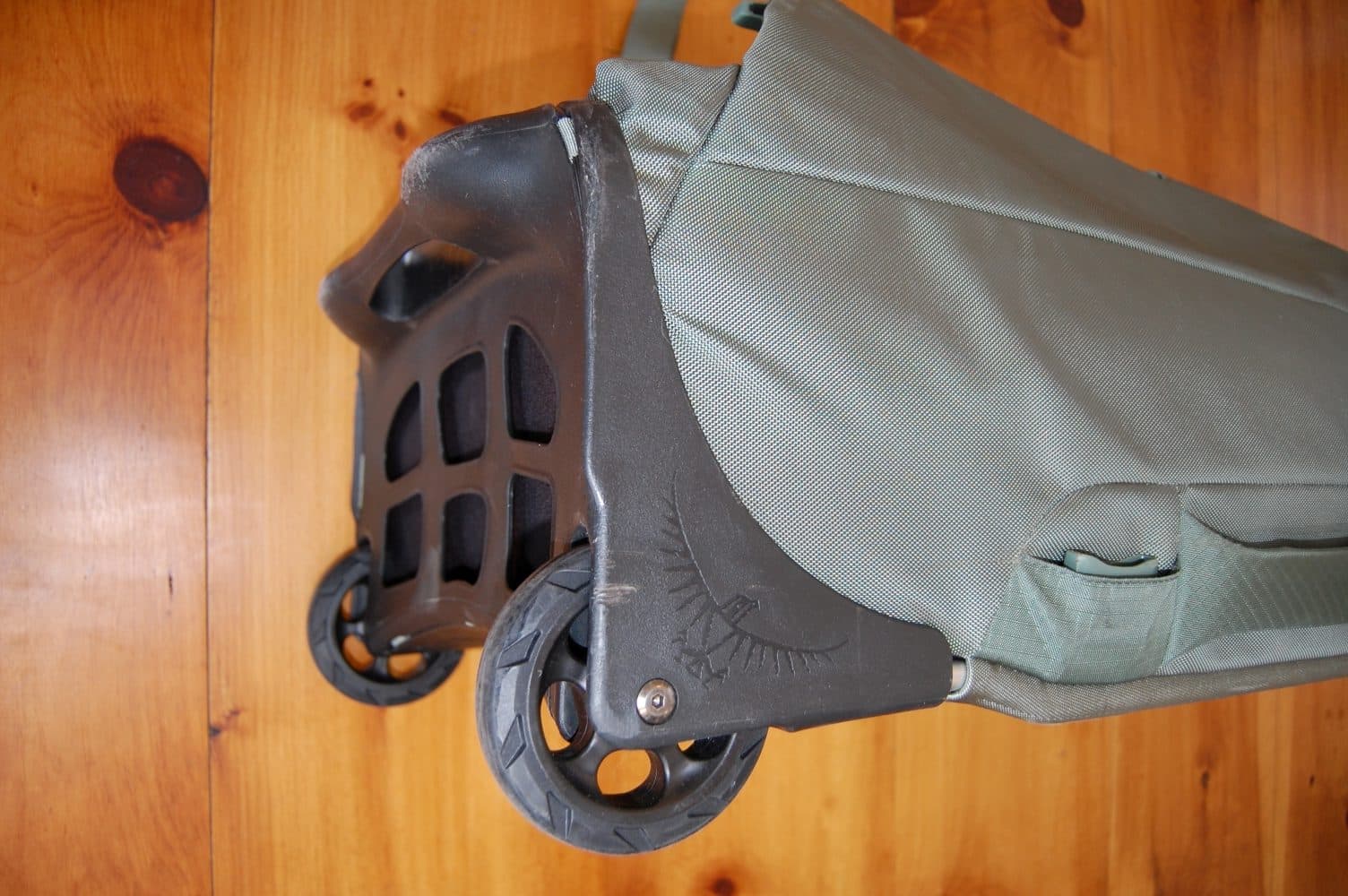 The HighRoad chassis on the Osprey Sojourn Shuttle 100L wheeled travel duffel.