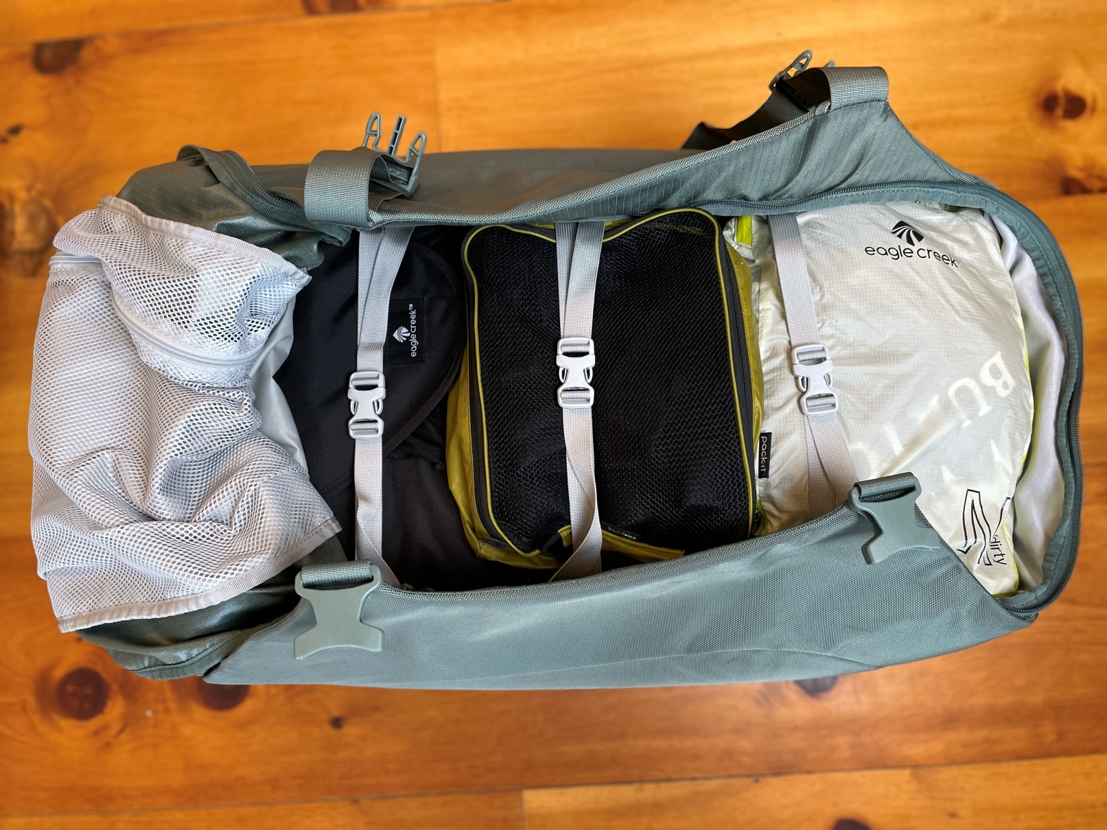 The compressions straps inside an Osprey Sojourn Shuttle 100L travel duffel