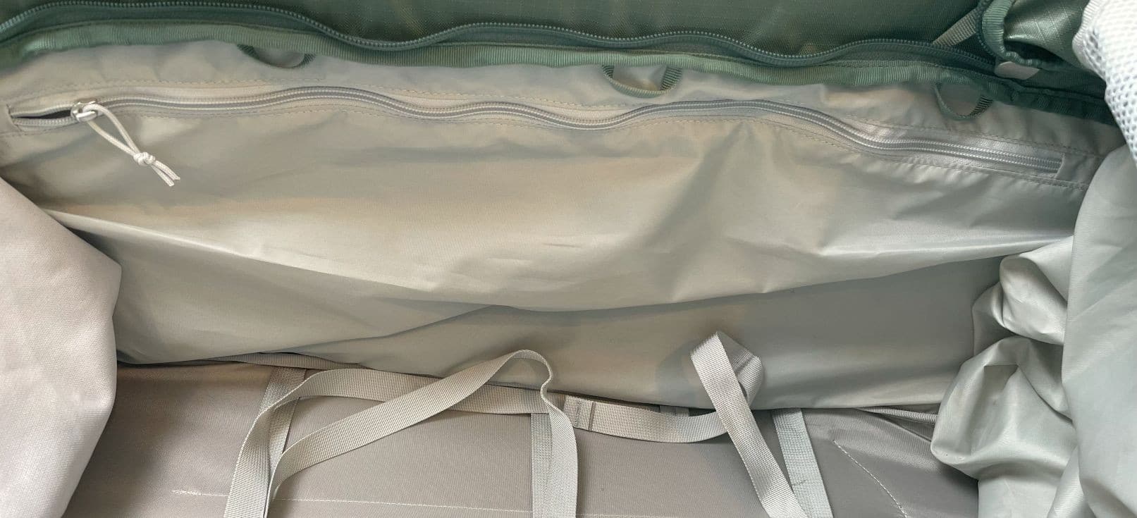 One of the interior pockets on the Osprey Sojourn Shuttle 100L travel duffel.