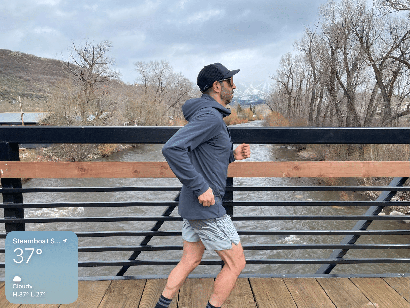 A man running in the Patagonia Nano Air Ultralight jacket.