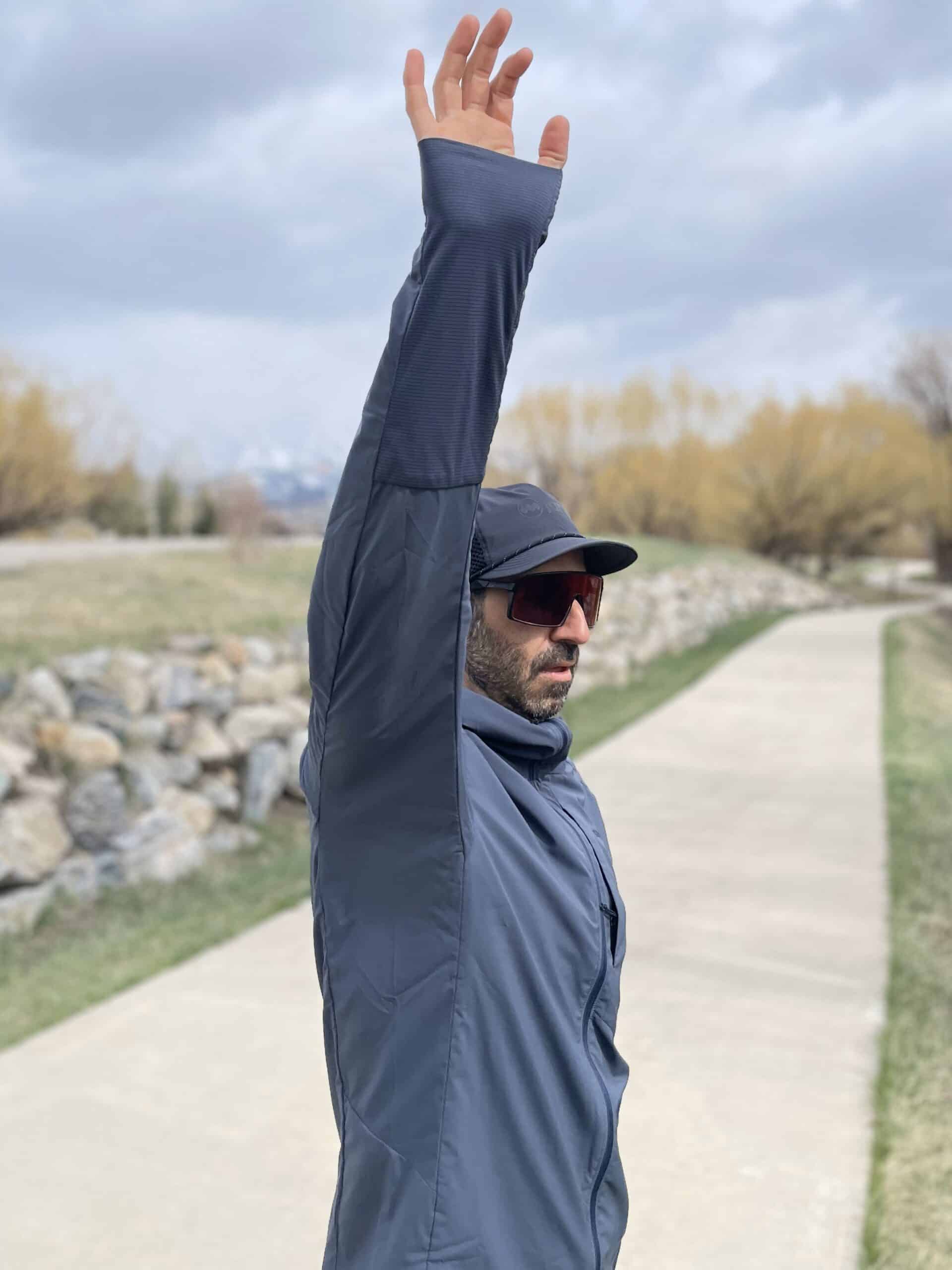 A runner showing the underarm panel on a Patagonia Nano Air Ultralight Jacket