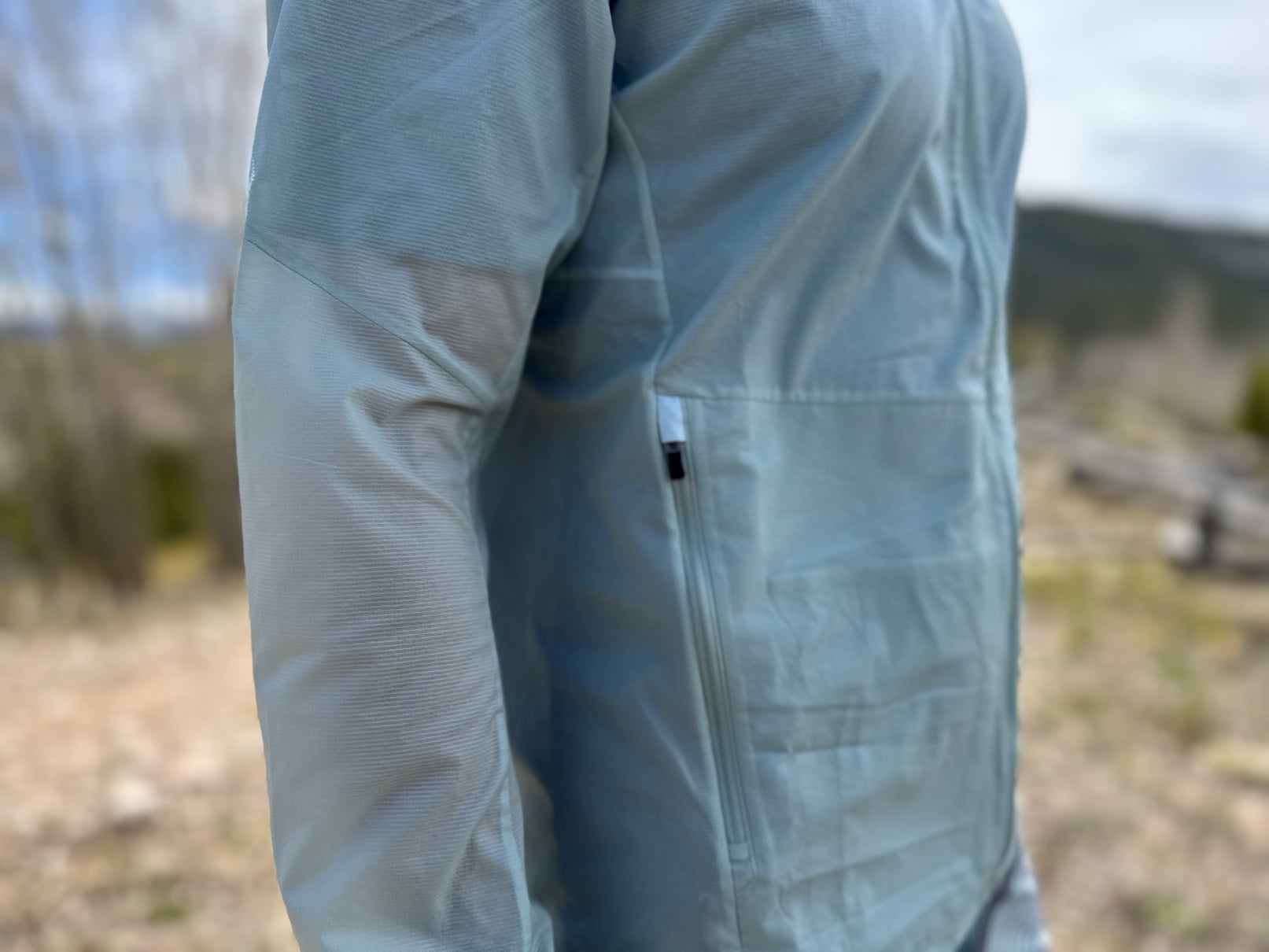 An image of the arm on an Arc'teryx Incendo Airshell hoody, showing the translucent fabric.