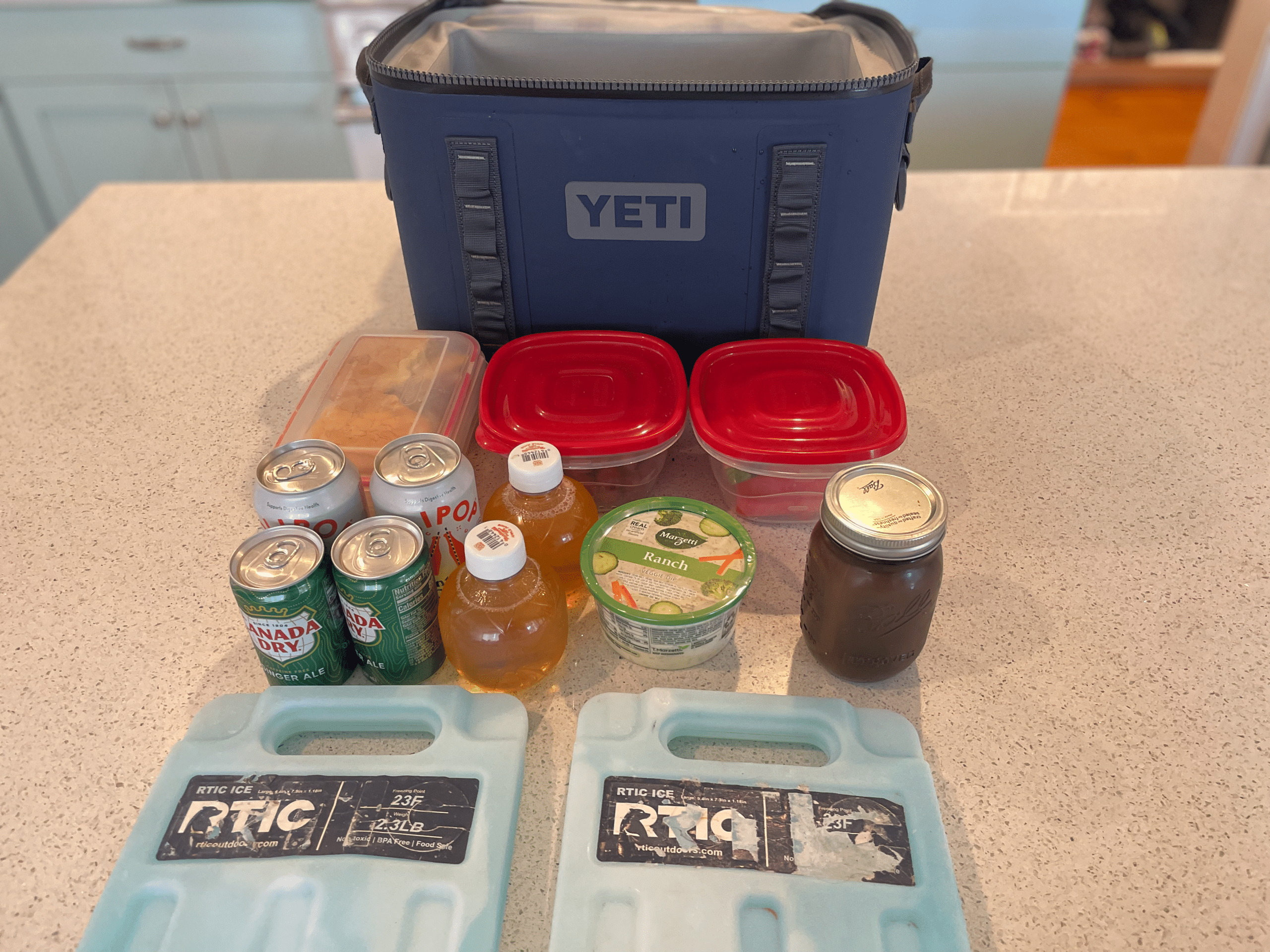 Image showing the YETI Hopper Flip 18 softcooler along with the contents I packed inside.