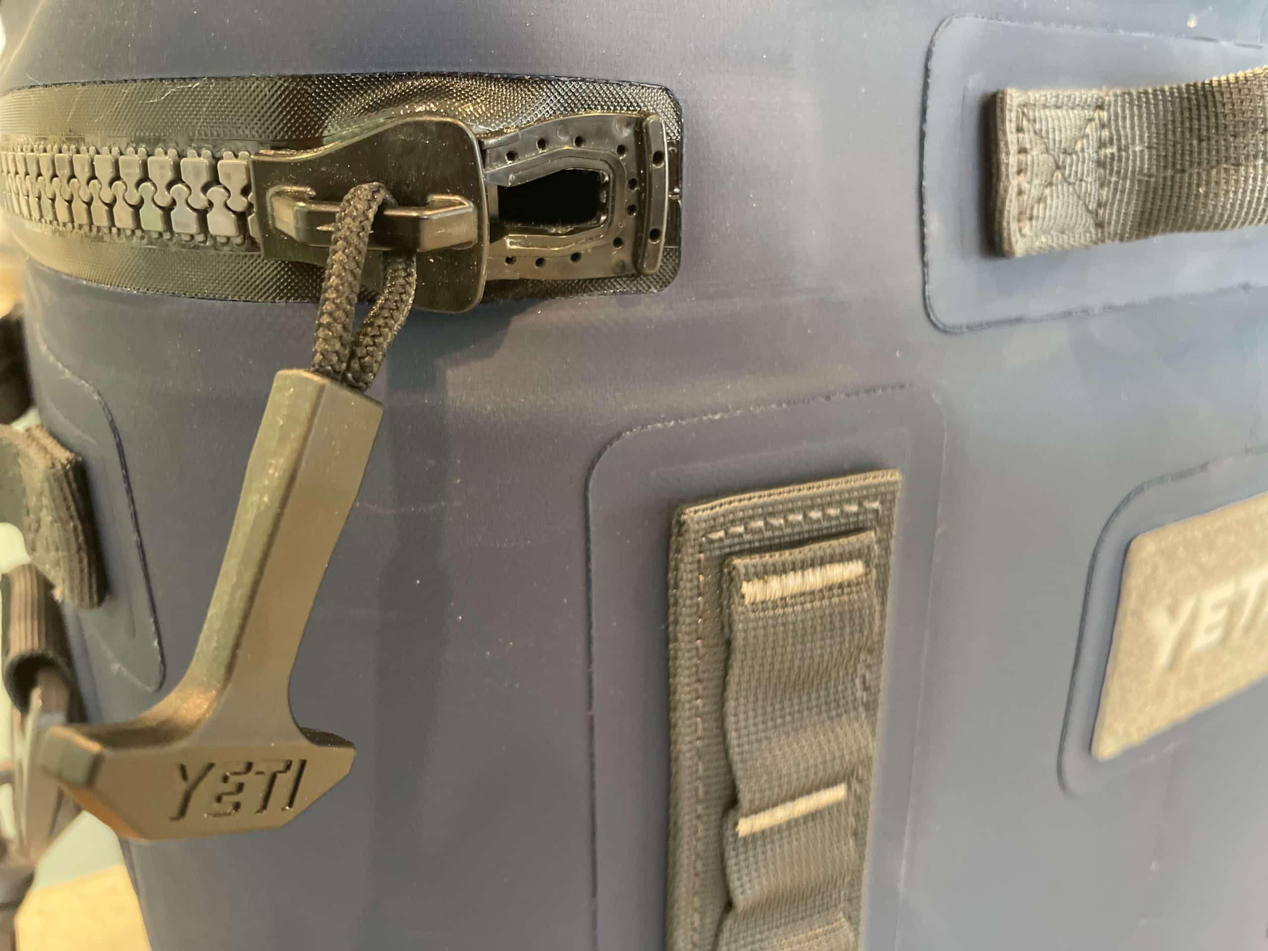The open zipper of the Yeti Hopper Flip 18 soft cooler.