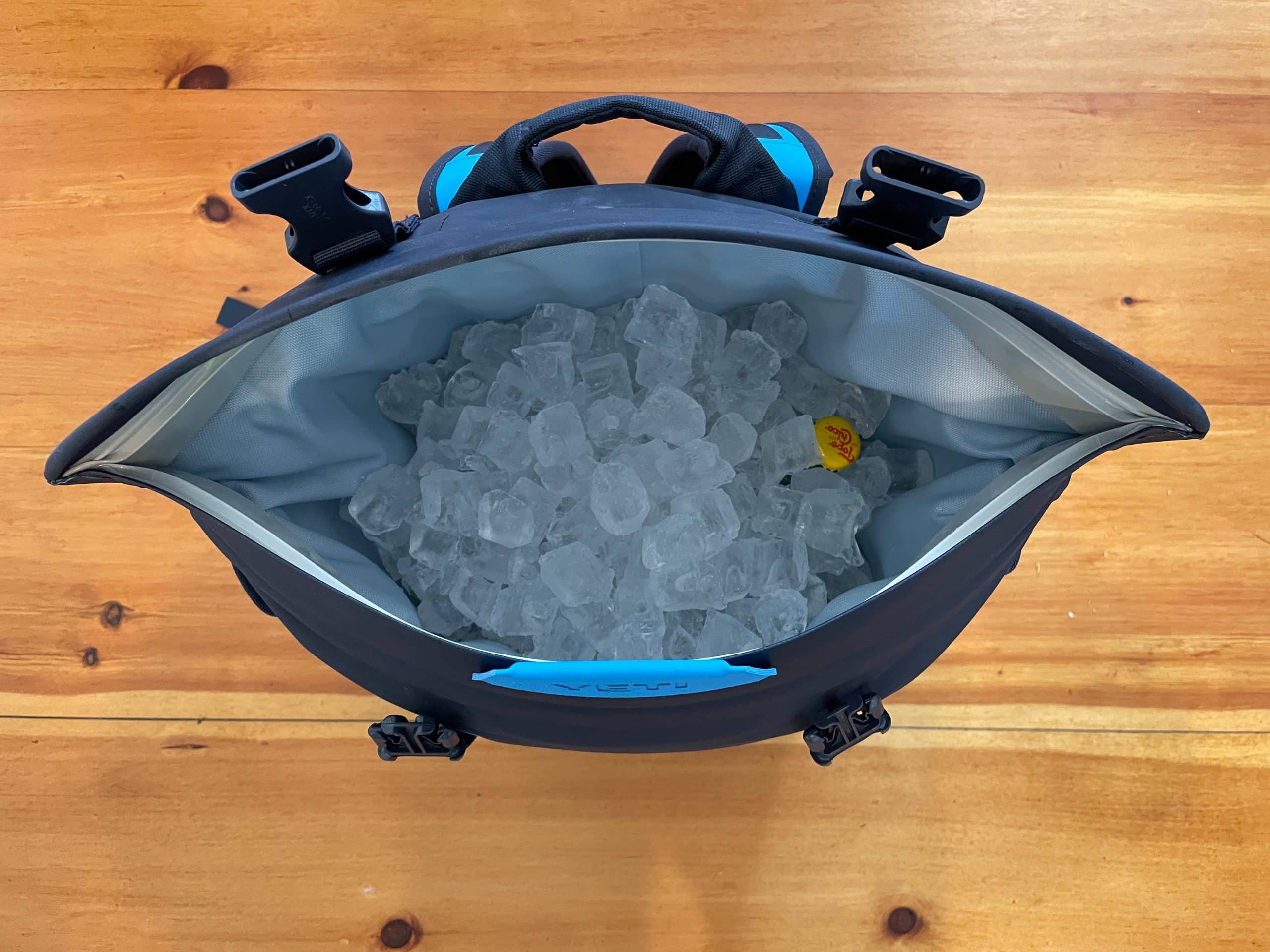 Showing ice filling empty space inside the YETI Hopepr m20 backpack cooler.