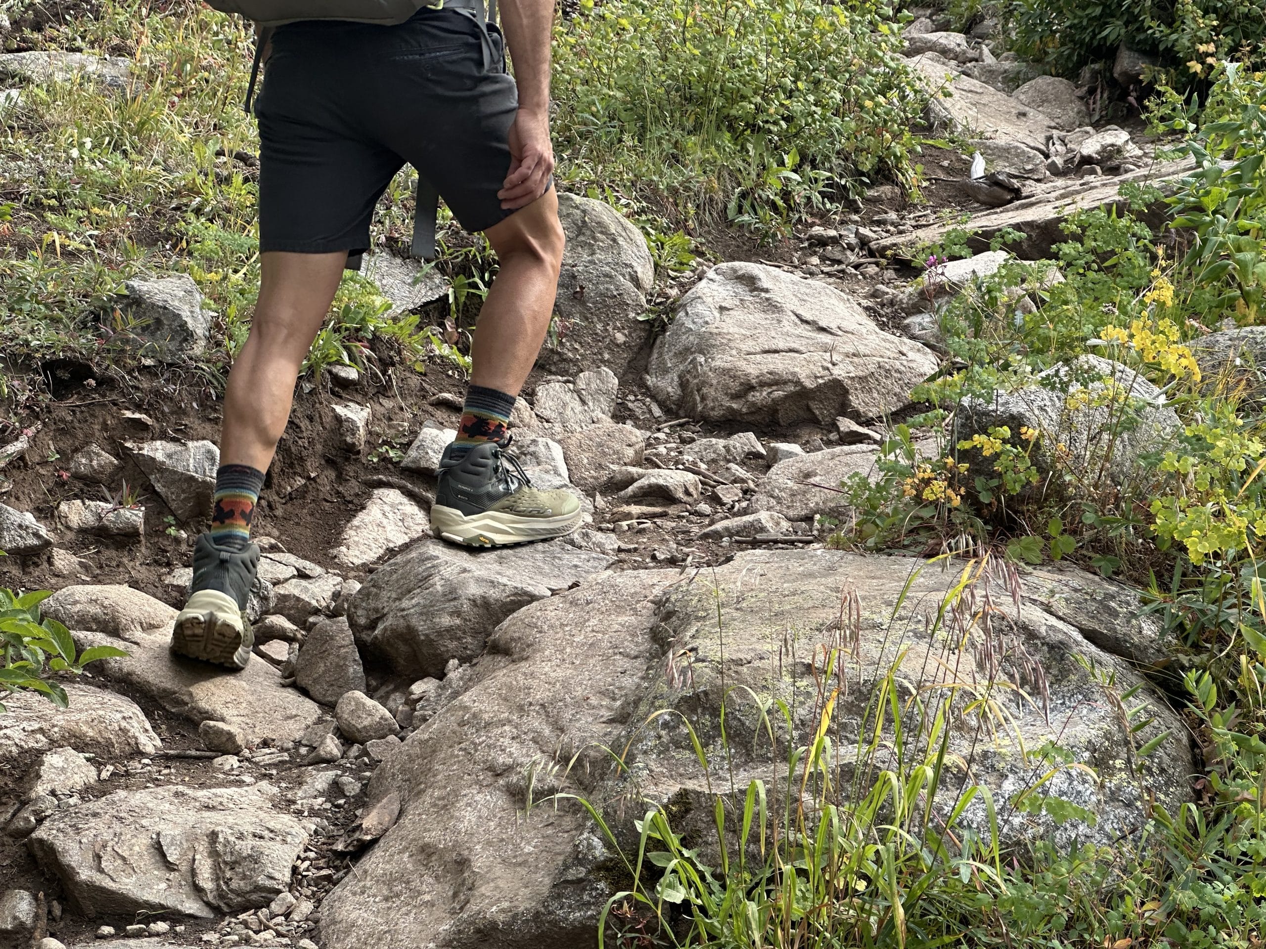 Backpacking in steep terrain wearing the Altra Olympus 6 Hike Mid GTX boot.