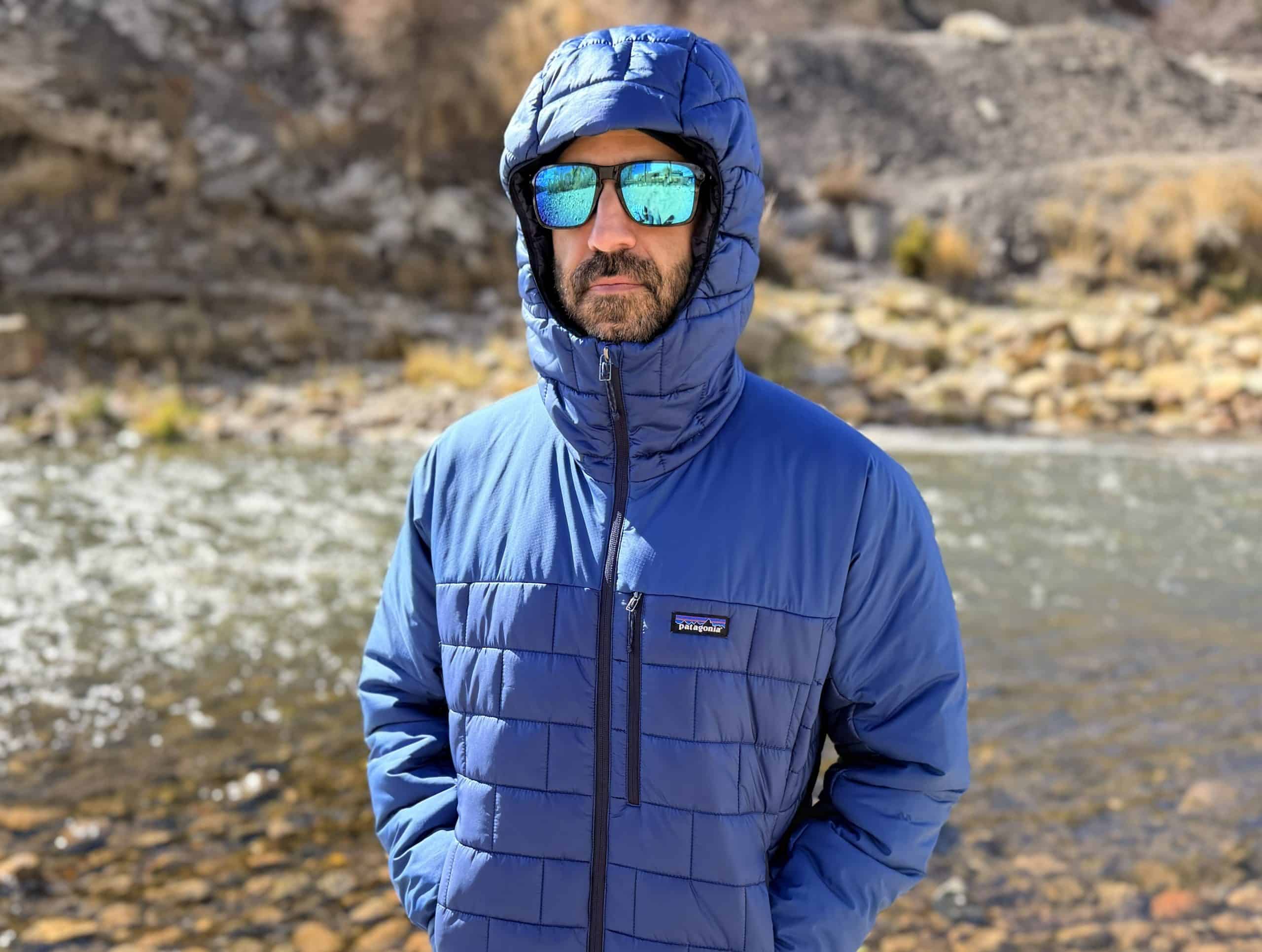 A man wearing the Patagonia Hi-Loft Nano Puff Hoody in Clement Blue, with the hood up.
