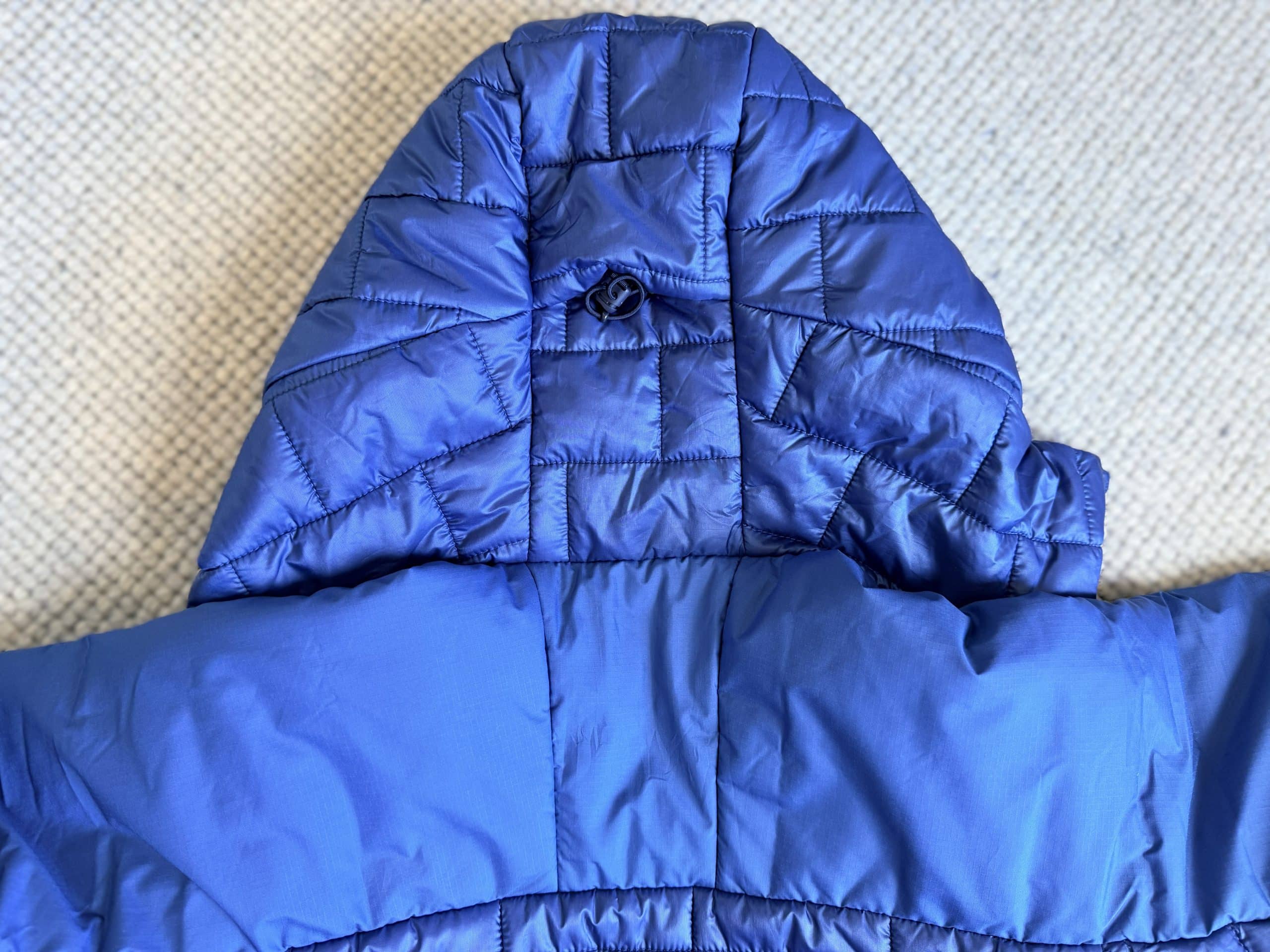 The back of the hood of a Patagonia Hi-Loft Nano Puff jacket.