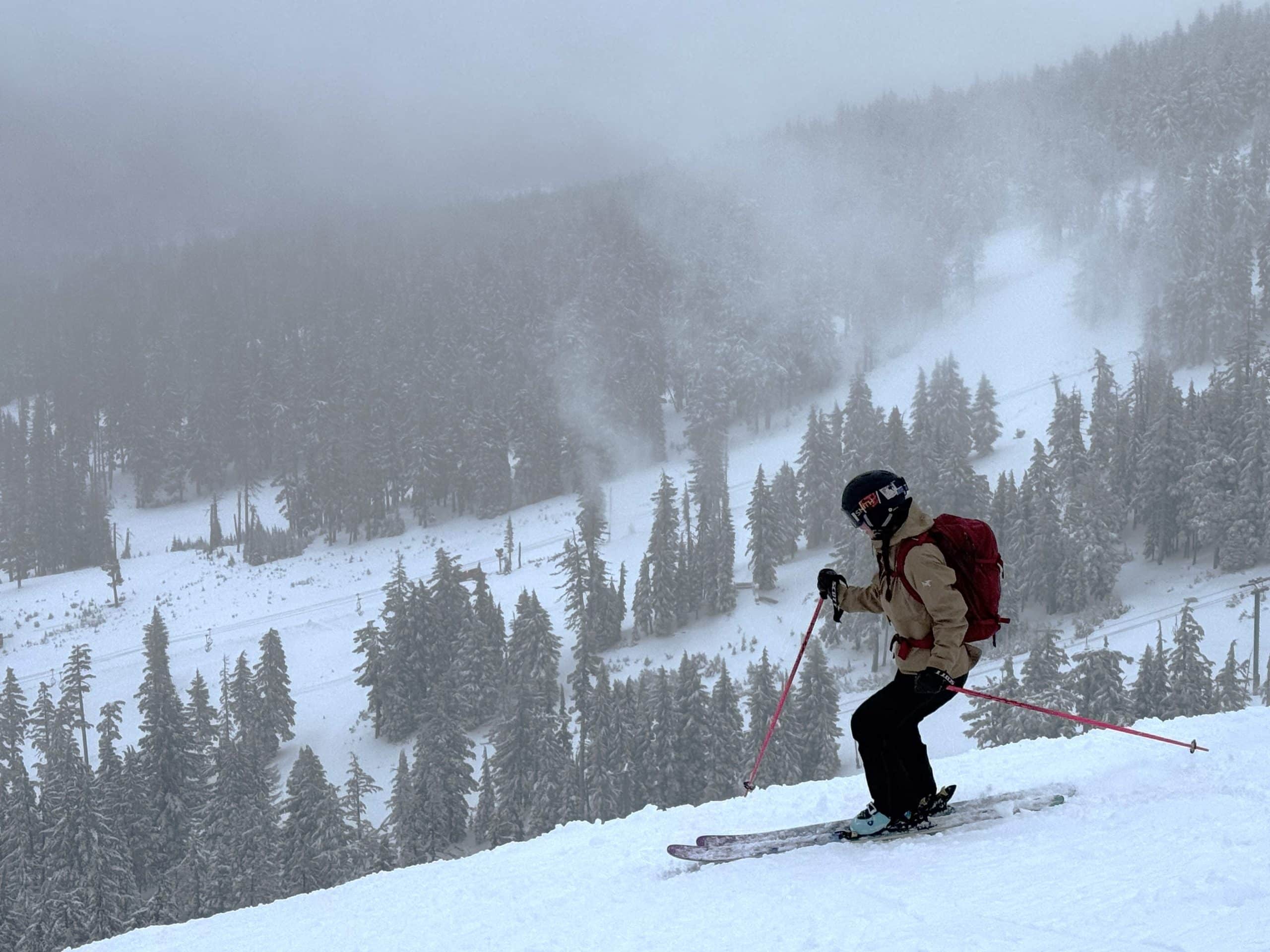 A woman backcountry skiing in the Arc'teryx Liatris jacket.