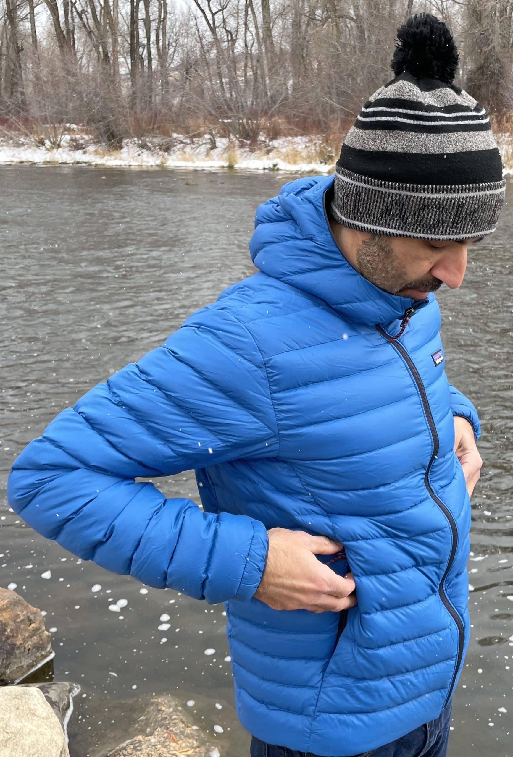 Wearing the men's Patagonia Down Sweater in blue.