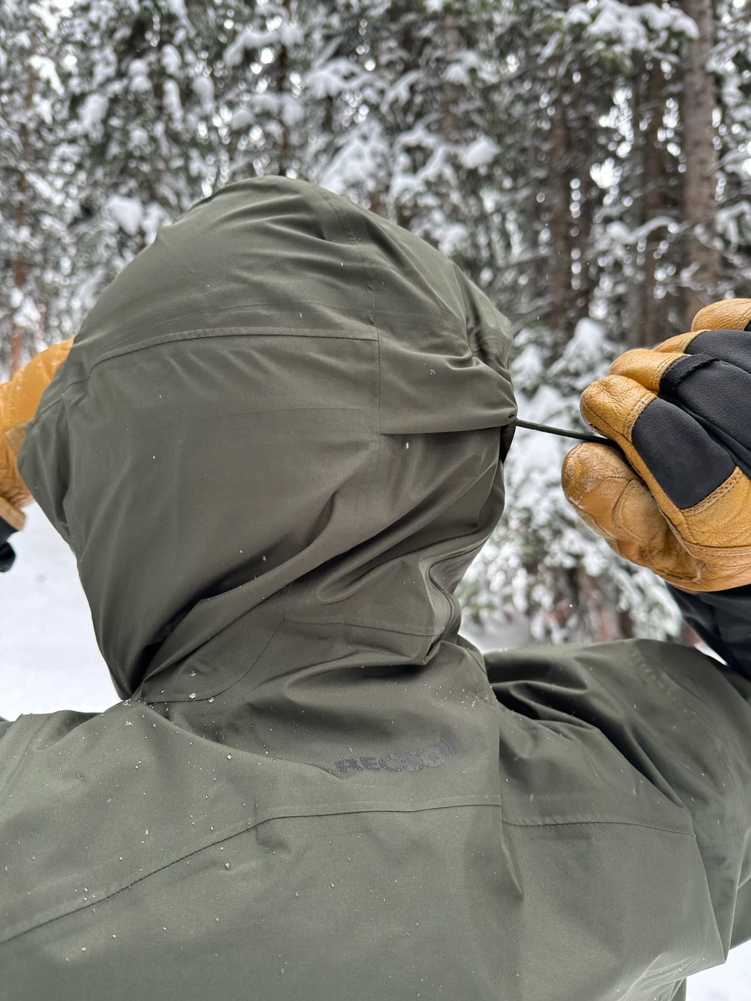 The rear adjustment point on the hood of a Patagonia Powder Town jacket.