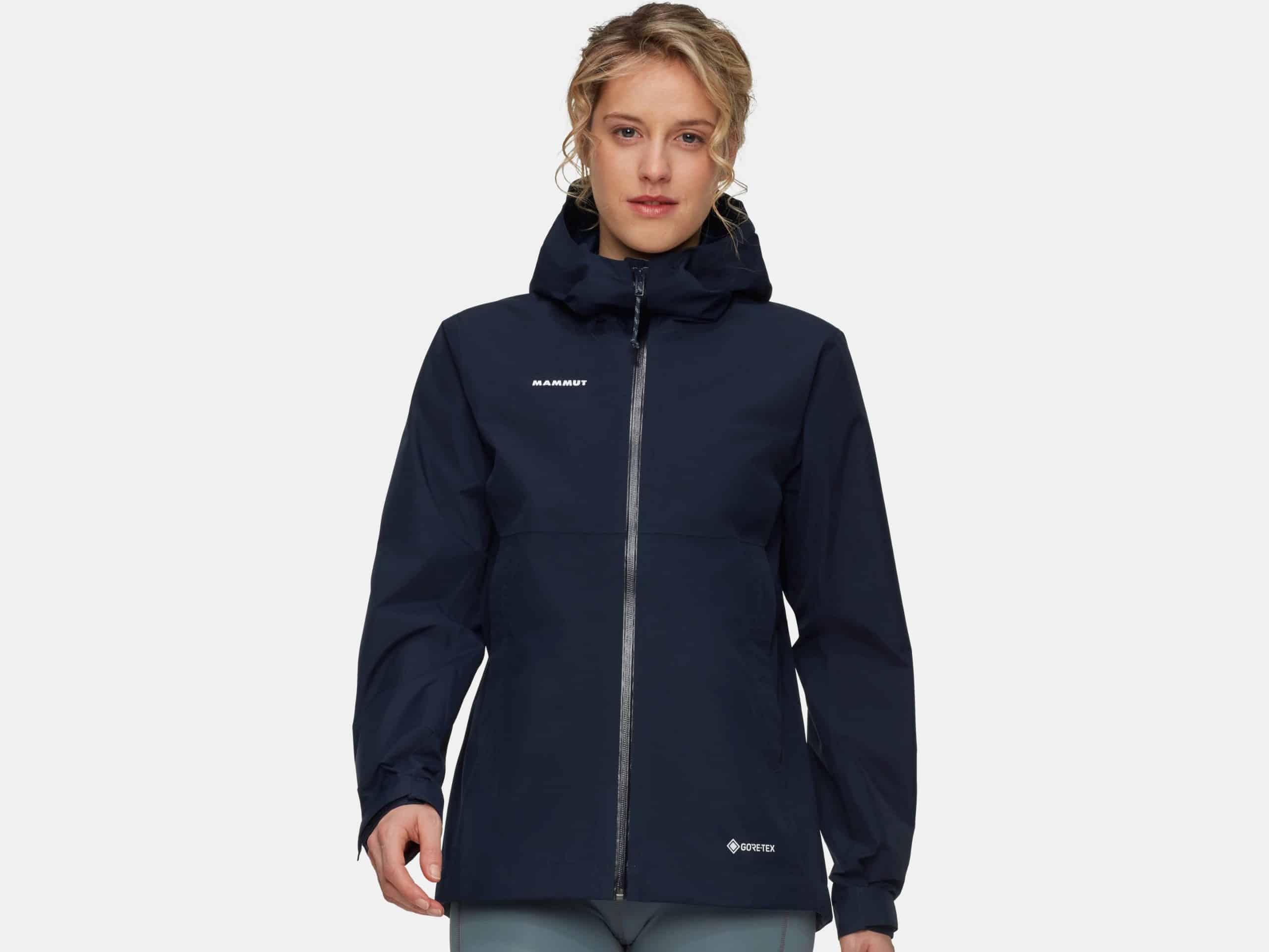 A woman wearing the Mammut Treeline HS rain jacket