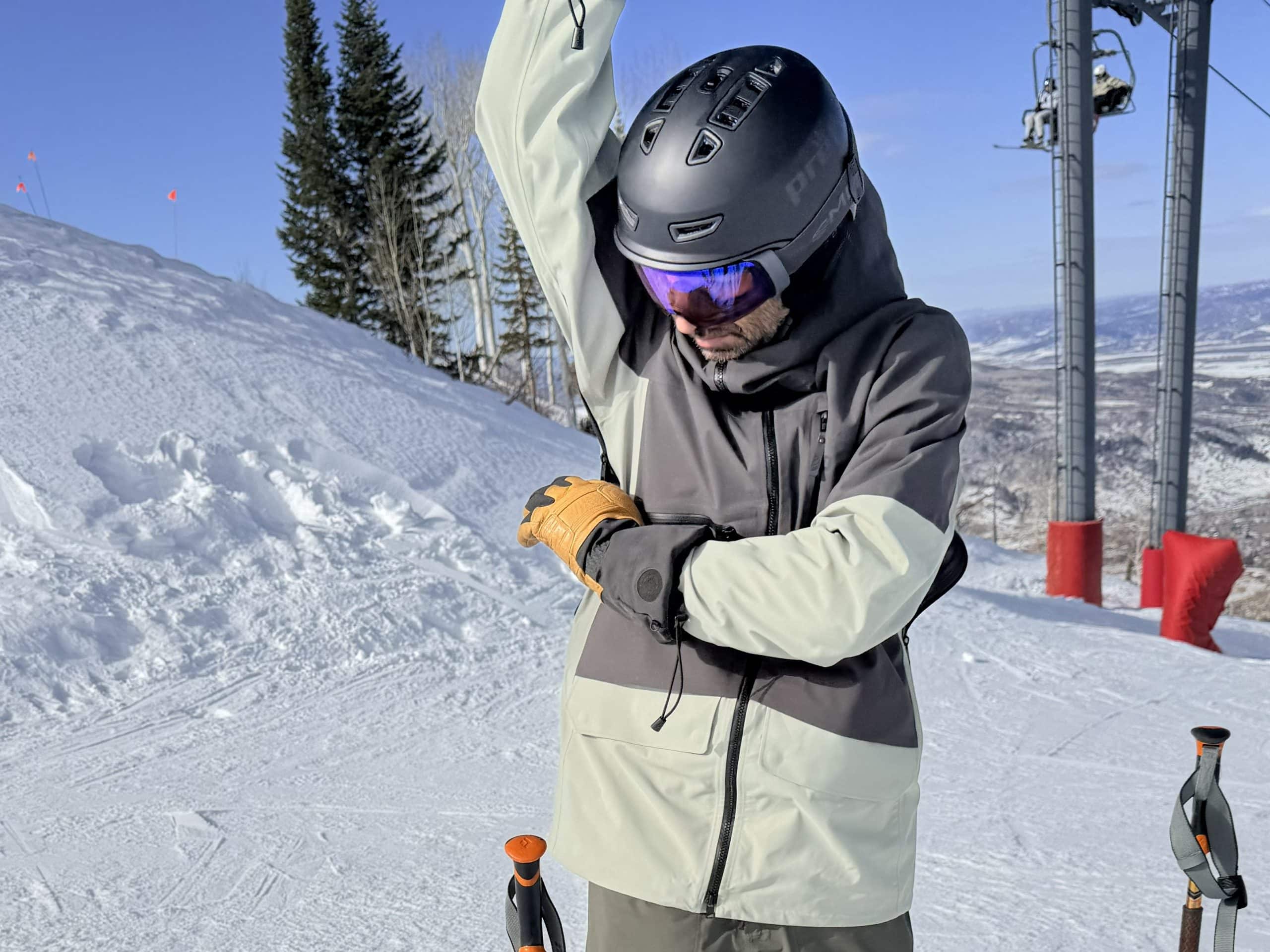 OPening the underarm vents on the Stio Figment freeride ski jacket.