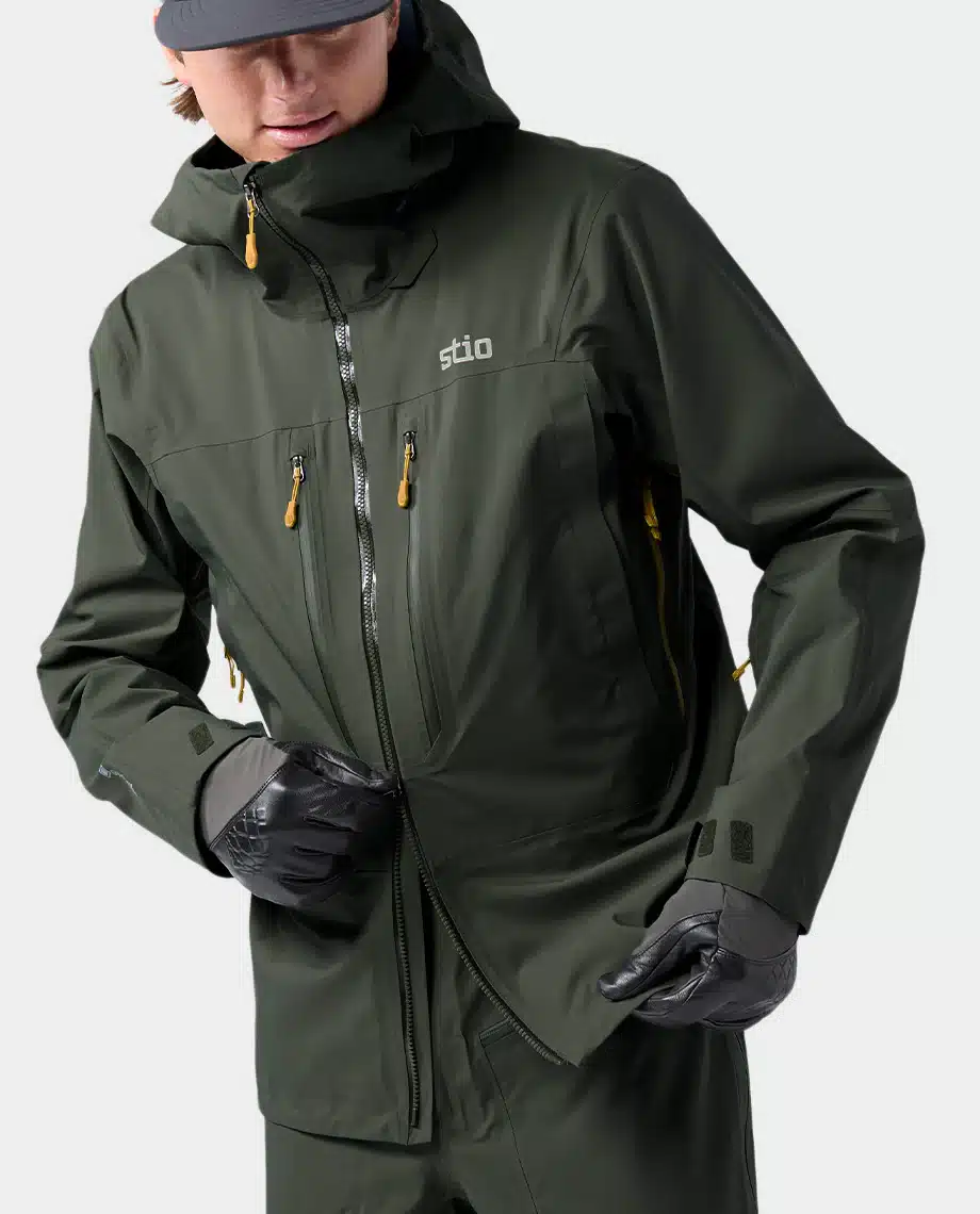 A man wearing the Stio Objective Pro jacket.