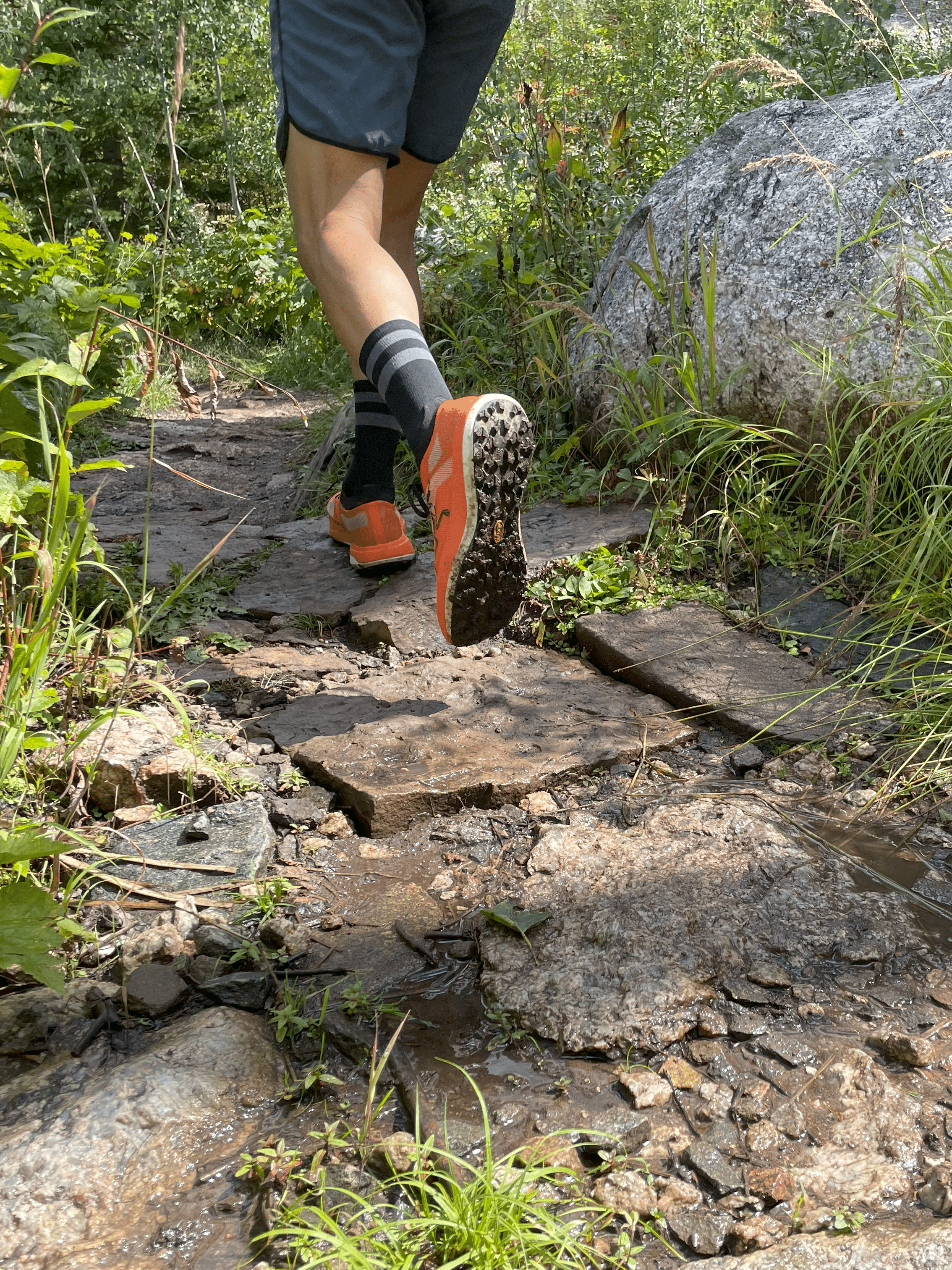 Arcteryx Sylvan Pro shoe on a runner, taken from behind.