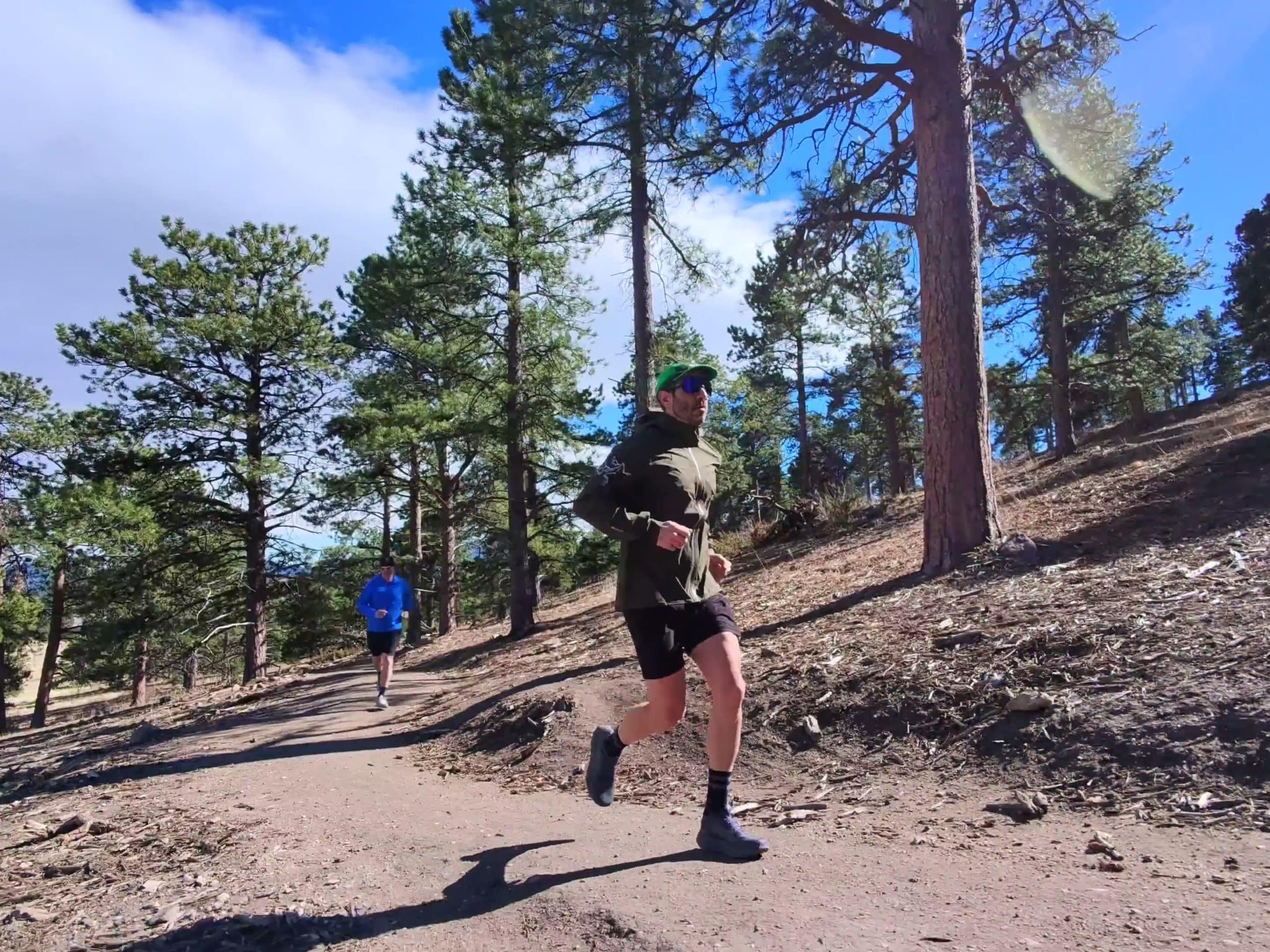 A trail runner wearing the Arc'teryx Sylan 2 shoe.