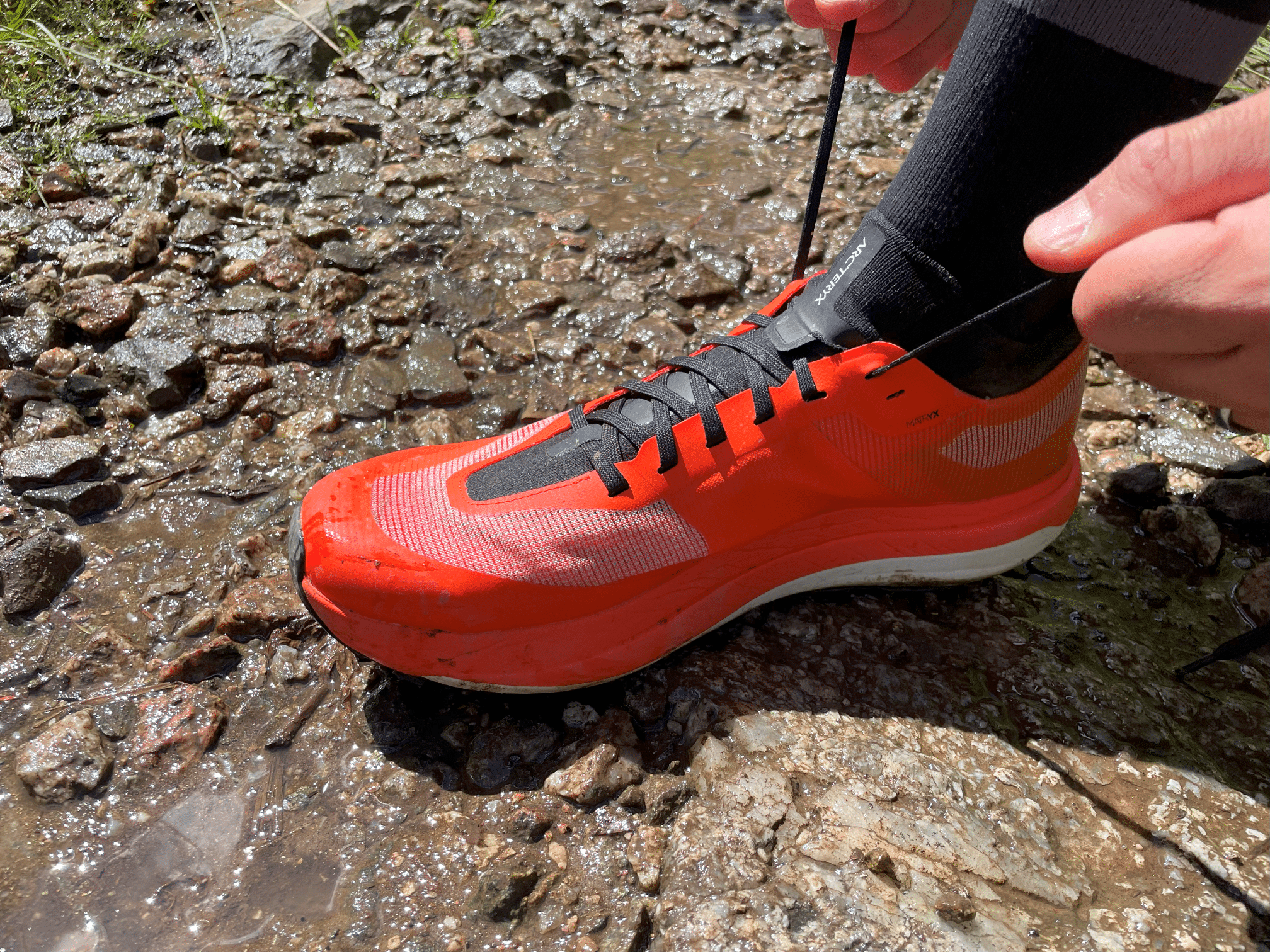 image of tying the laces on Sylvan Pro Arc'teryx shoes