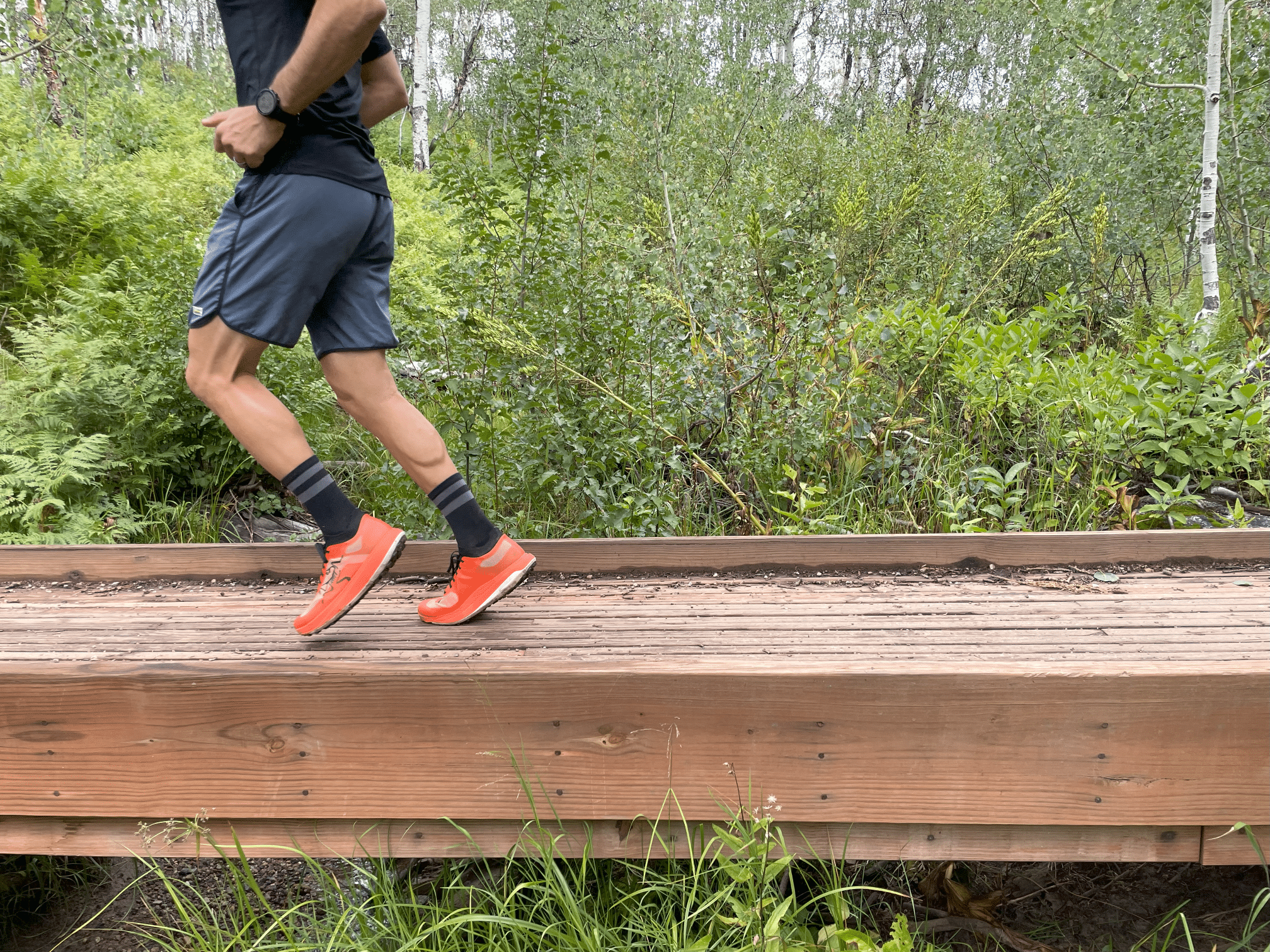 image of runner on bridge with the arcteryx sylvan pro shoe