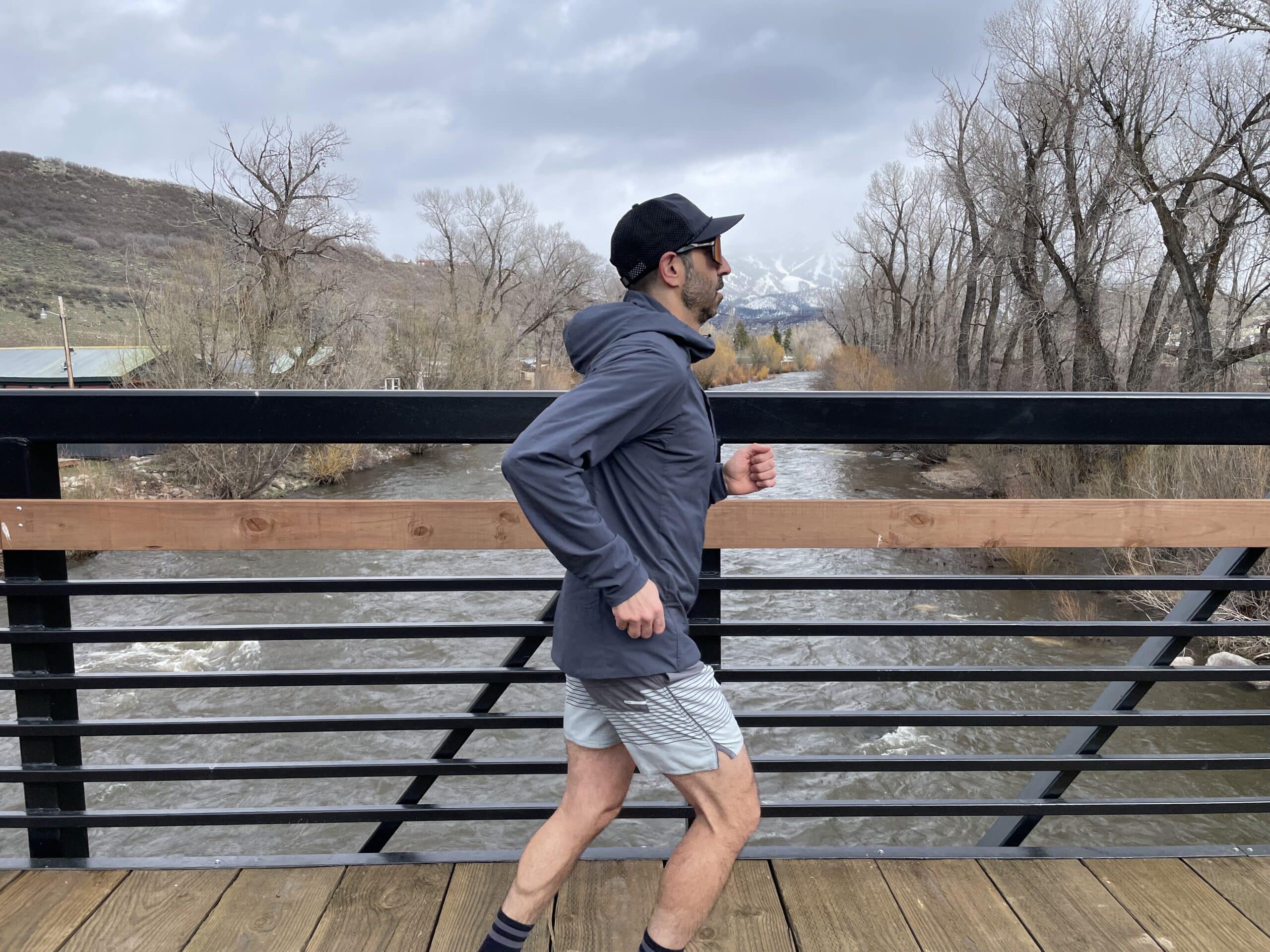 A man running in the Patagonia Nano Air Ultralight jacket.