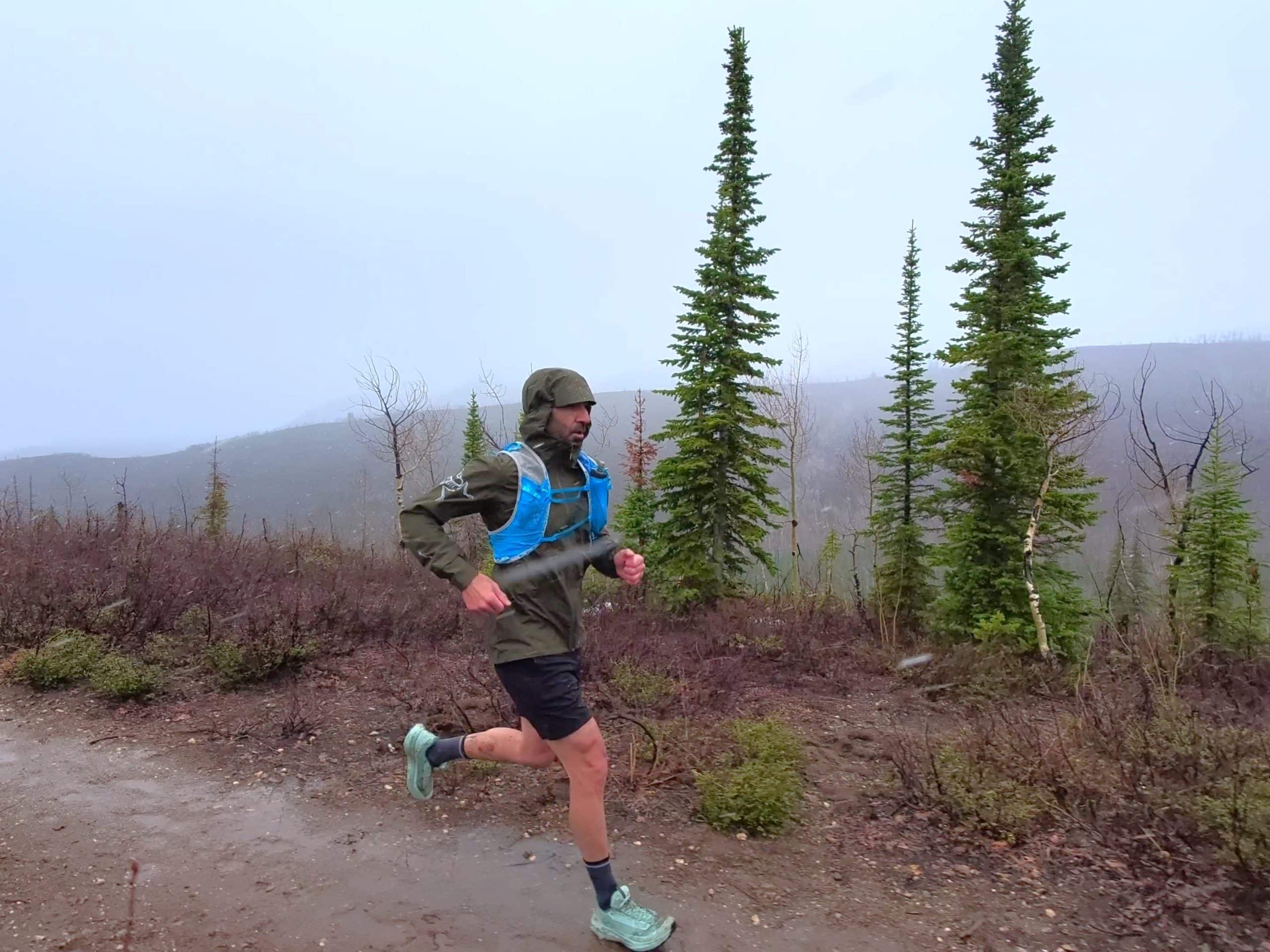 Trail running in the rain while wearing the Arc'teryx Norvan GORE-TEX jacket.