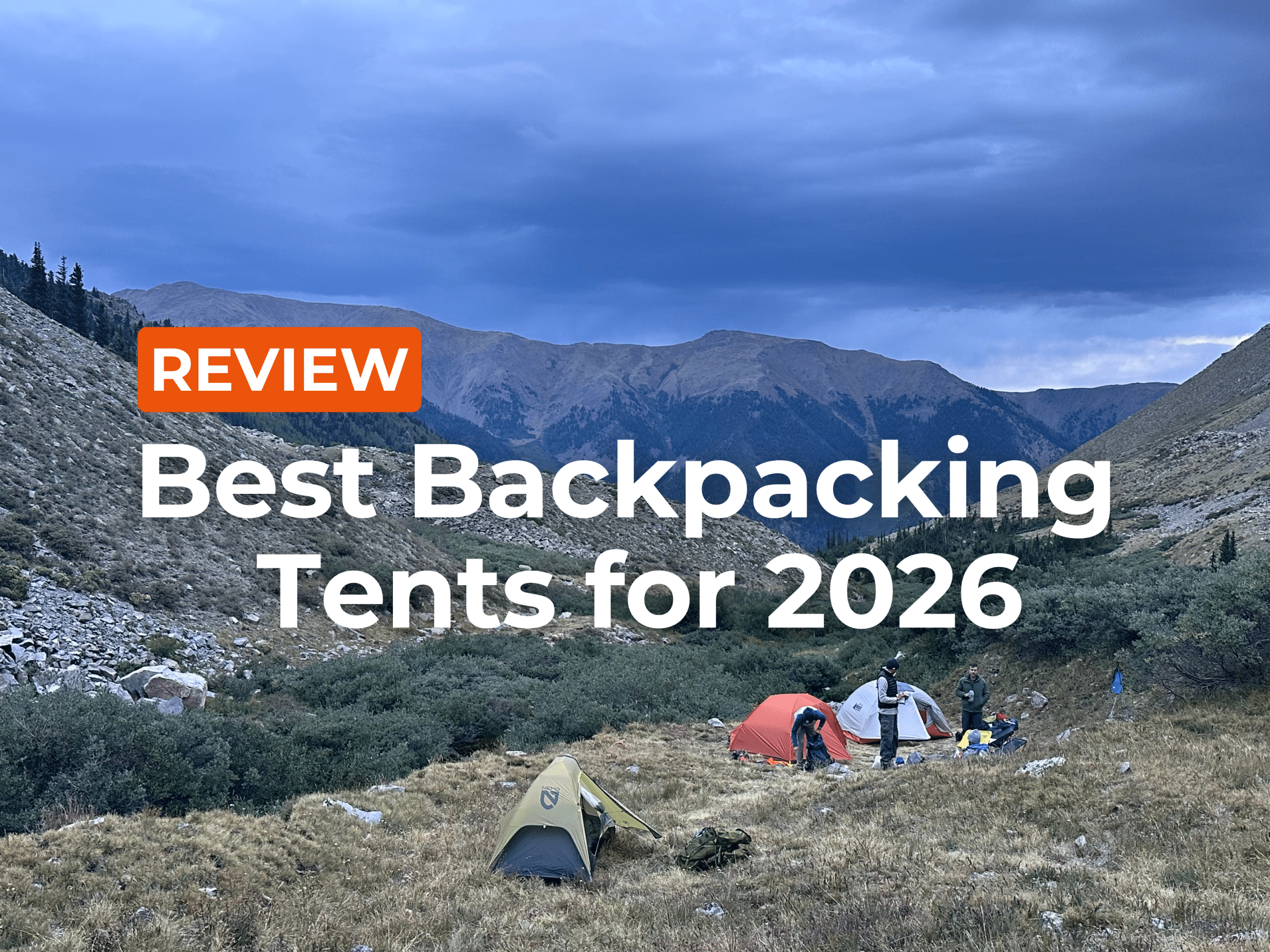 Article hero image for Best Backpacking Tents, showing backpackers setting up a high-alpine camp.